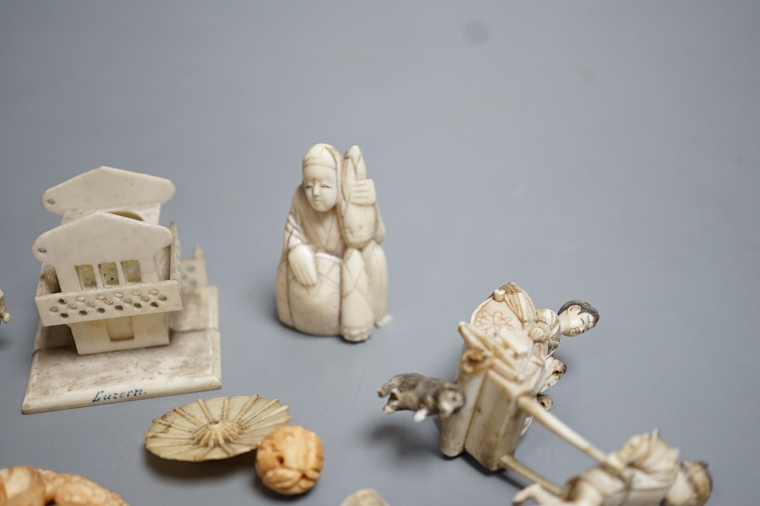 A Japanese ivory skull and toad okimono, various Chinese and Japanese ivories, late 19th/early 20th century